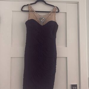 Elegant Black Sleeveless Dress with Embellished Neckline